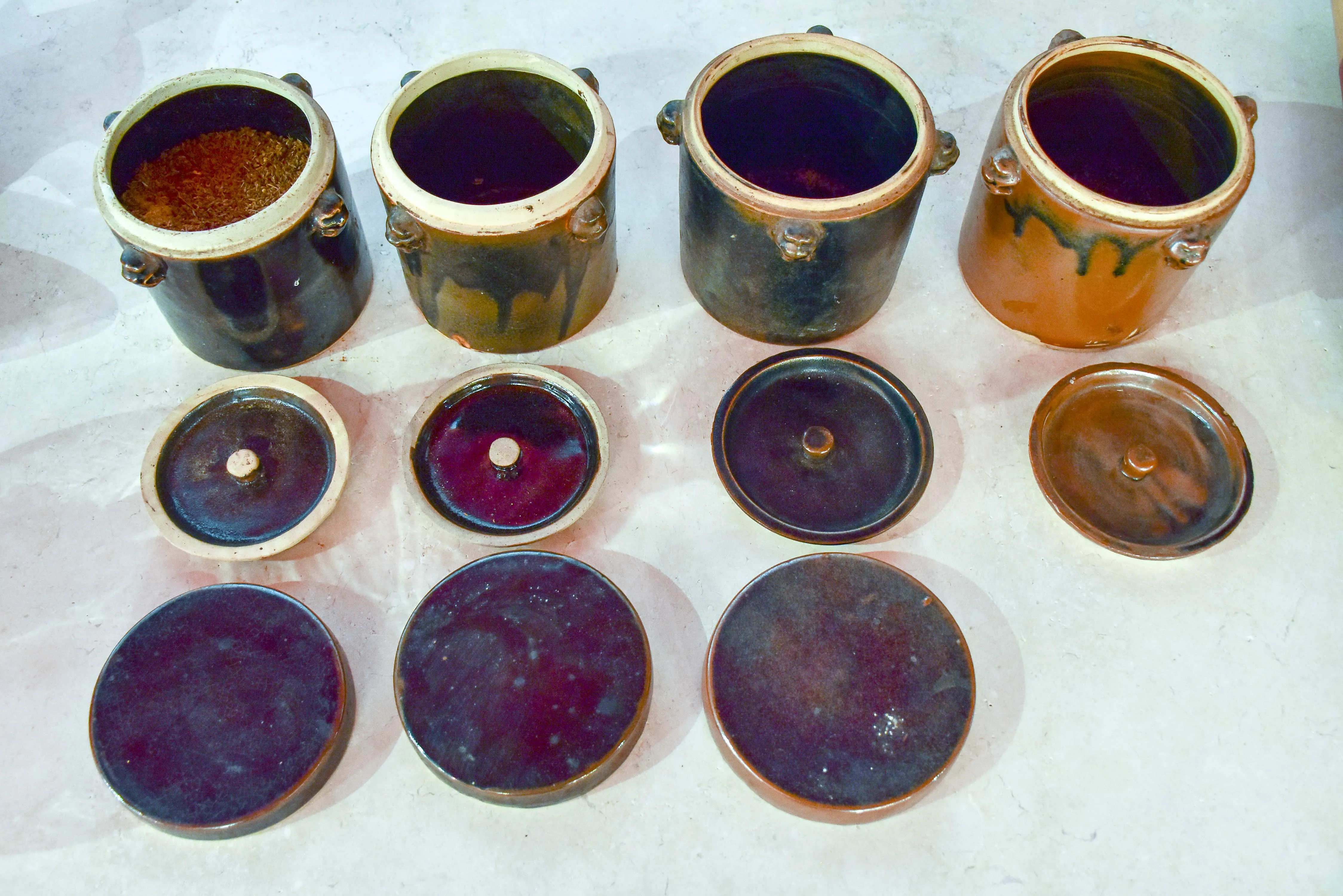 Collection of three double-lid stoneware tea canisters