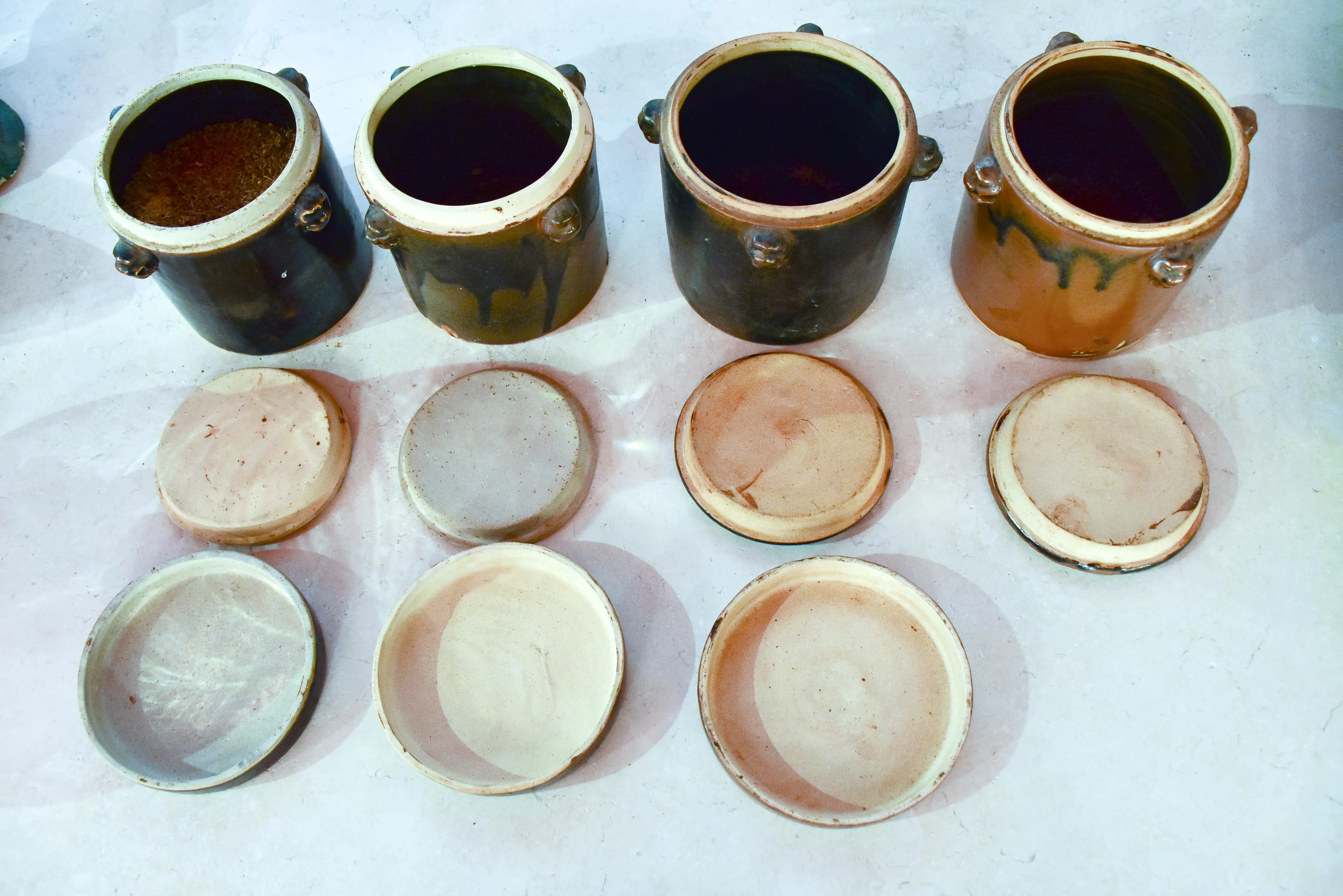 Collection of three double-lid stoneware tea canisters